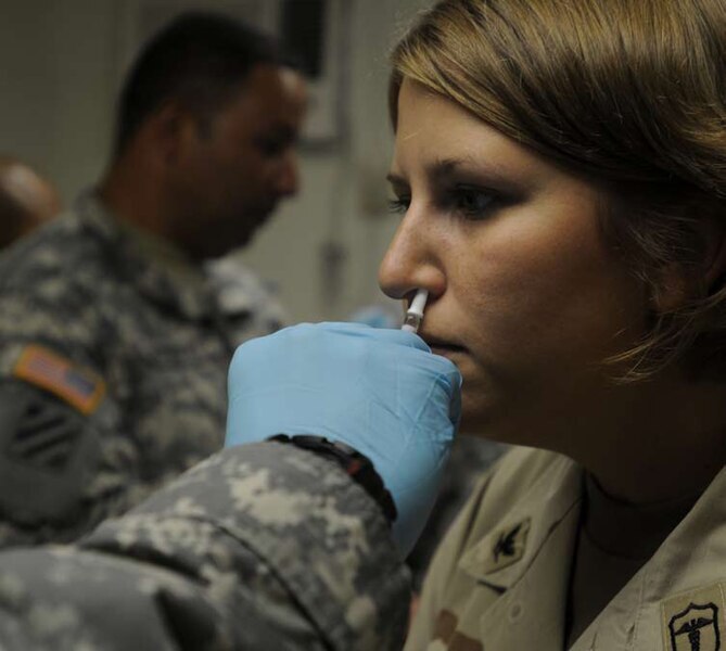 Intranasal vaccine administration
(https://commons.wikimedia.org/wiki/File:GI_receives_an_intranasal_mist_of_the_flu_vaccine_at_Guantanamo.jpg)
